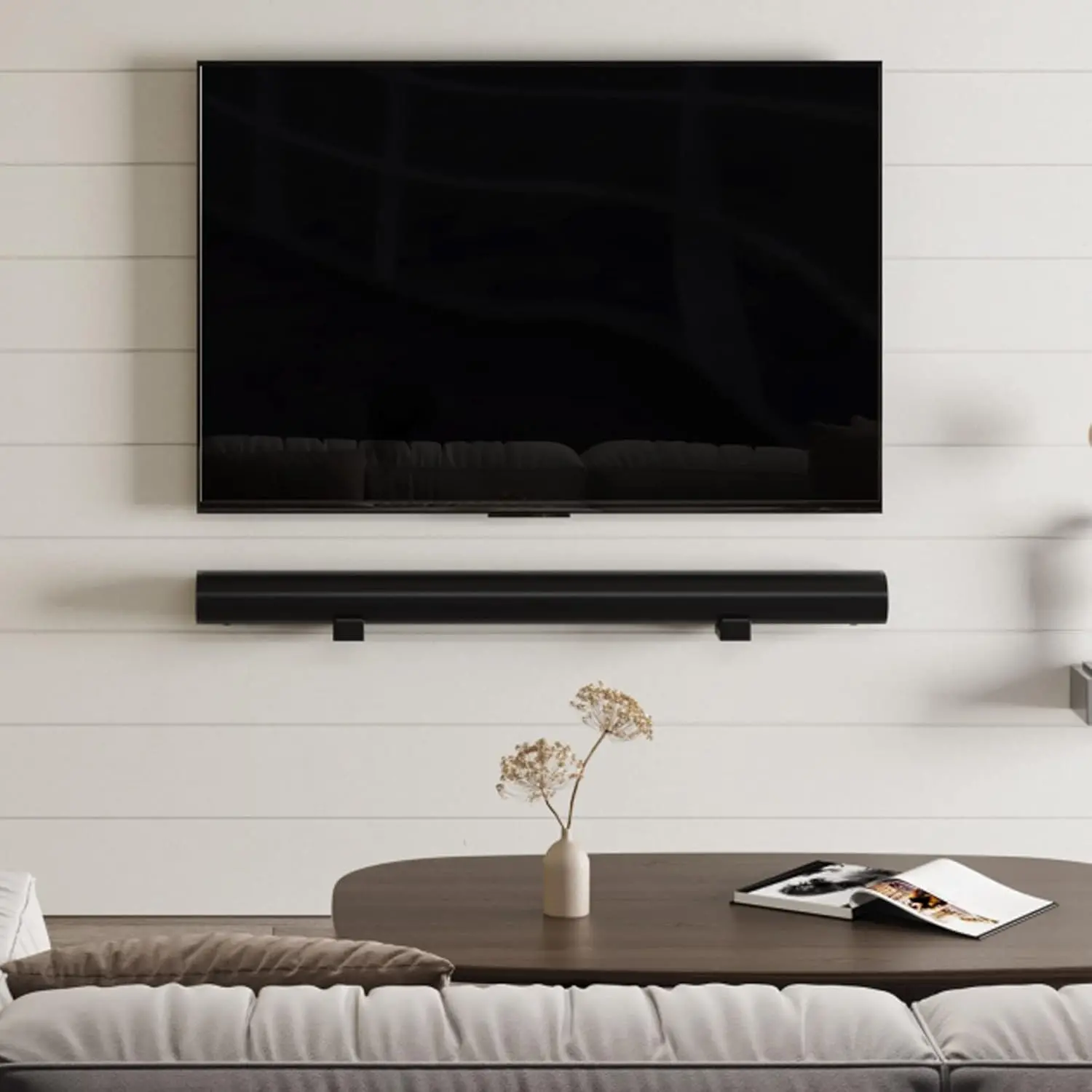 Television and soundbar neatly aligned on a living-room wall